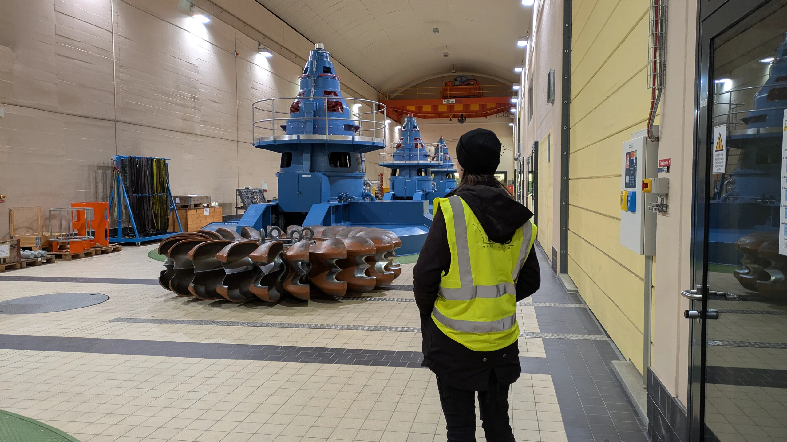 Woman admiring the constructions of the underground power plant at Grimselwelt, Switzerland